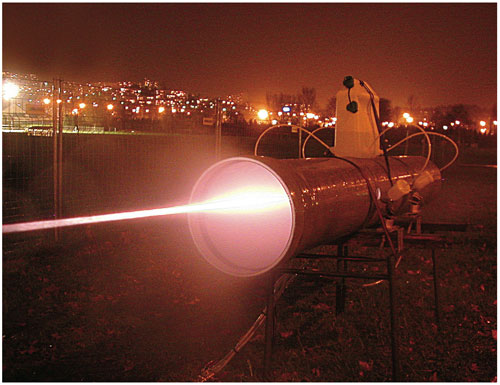 In an experiment to test how well the Teramobile system works when the air is not clear, an artificial cloud of water droplets was formed within this 10-meter-long pipe. To the delight of the author and his colleagues, the droplets did not block the propagation of light filaments. Why not? Although such droplets may extinguish a filament in one position, the scattered photons then contribute to the formation of a new filament elsewhere. <strong>Photograph courtesy of Alexis Gratié/DAVM/Université Lyon 3</strong>