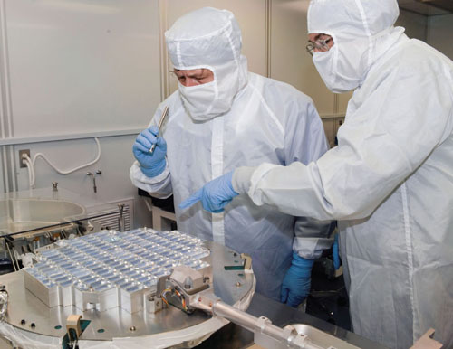 Aerogels found a niche as collectors of comet particles on NASA's <em>Stardust</em> mission. Here Mike Zolensky (<em>left</em>), <em>Stardust</em> curator and co-investigator, and Donald Brownlee, principal investigator with the University of Washington (<em>right</em>), study material in the detector after its return to Earth. <strong>Image courtesy of NASA.</strong>
