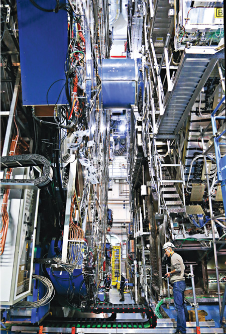 The ATLAS detector, where the author works, is one of two large devices at the Large Hadron Collider that gathered the historic evidence for the Higgs boson. The Higgs is crucial to the reigning Standard Model of particle physics because it explains how particles get their masses, but it leaves major gaps in understanding. <strong>Photograph by Claudia Marcelloni De Oliveira.</strong>