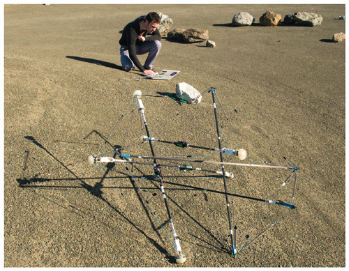 Engineers test a prototype of NASA’s Super Ball Bot, a tensegrity robot that is designed to be used as a planetary lander. Compliance inherent in the structure of the robot should allow it to withstand high-velocity collisions.  <strong>Image courtesy of NASA Ames Research Center/Ken Caluwaerts (Ghent University).</strong>