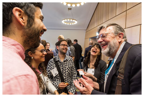 William D. Phillips, who shared the Nobel Prize in Physics in 1997 for laser-cooling atoms, banters with young scientists at the 66th Lindau Nobel Laureate Meeting, held in June 2016 in Germany. <strong>Photo courtesy of Christian Flemming/Lindau Nobel Laureate Meetings</strong>