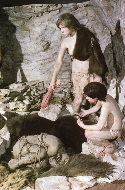 Neanderthals buried their dead to the accompaniment of rites that apparently varied from one region to another. In the scene reimagined above (based on a site in Regourdou, France), the limbs of the deceased man were tucked in and bound as if to inter the body in the fetal position, whereas a burial site not far from Madrid was found to include many horn cores, antlers, and even a rhinoceros skull, apparently with symbolic significance. <strong>Tom McHugh/Science Source</strong>